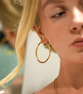 Woman wearing hoop earrings